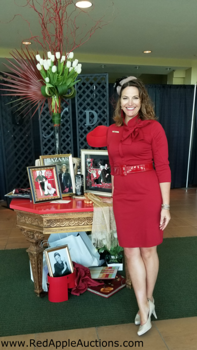 Female auctioneer Sherry Truhlar Red Apple Auctions at Volunteers in Medicine auction